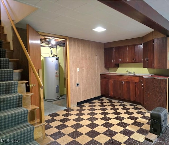 36277 Butcher Rd, Salem, OH 44460 - kitchen featuring electric water heater, light flooring, light countertops, and wooden walls