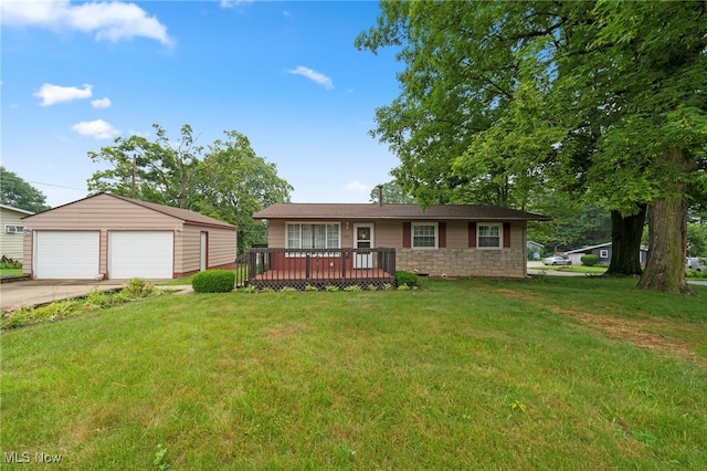2100 Priscilla Ave NW, Massillon, OH 44647 - view of front of home with an outdoor structure, a detached garage, a deck, and a front yard