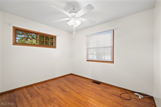 2100 Priscilla Ave NW, Massillon, OH 44647 - unfurnished room with wood finished floors and a ceiling fan