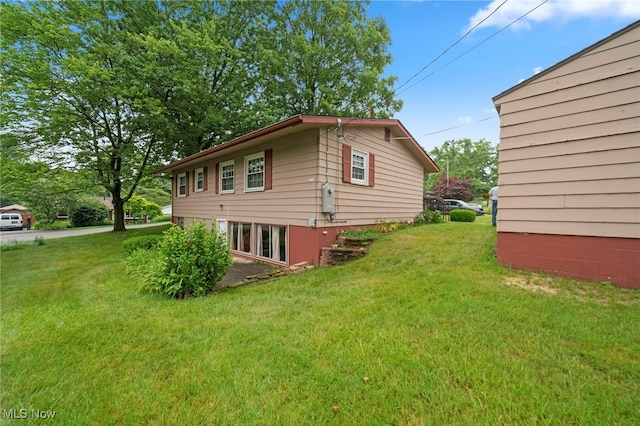 2100 Priscilla Ave NW, Massillon, OH 44647 - view of side of home featuring a yard