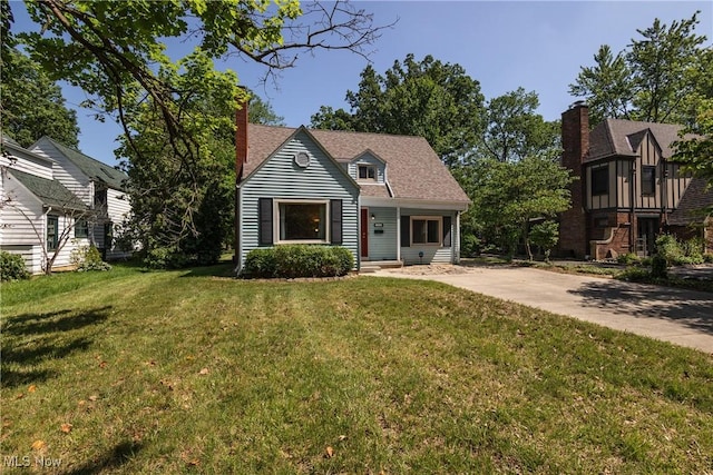 260 Morgan, Oberlin, OH 44074 - view of front of house with a front yard and a chimney