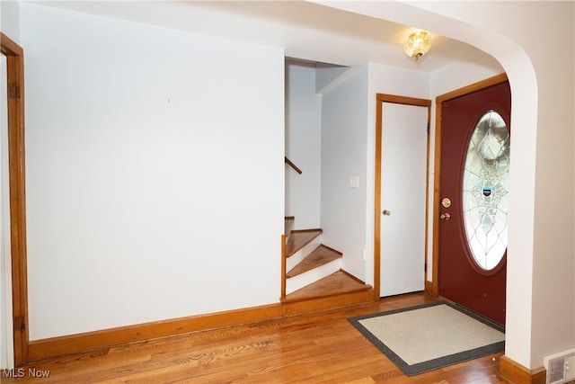 260 Morgan, Oberlin, OH 44074 - entryway with light wood-style flooring, arched walkways, and stairs