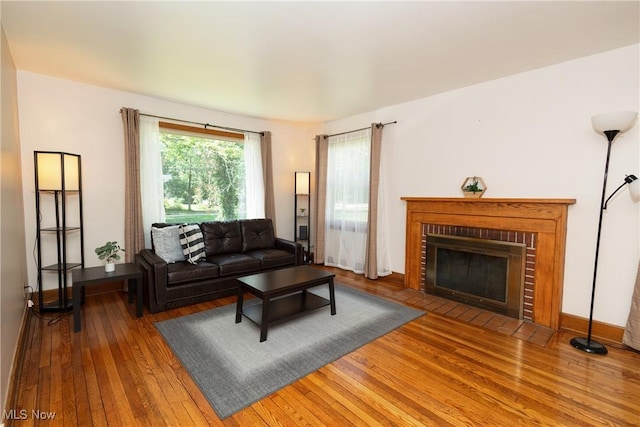 260 Morgan, Oberlin, OH 44074 - living area featuring wood-type flooring and a brick fireplace