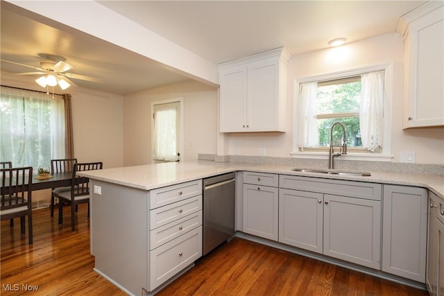 260 Morgan, Oberlin, OH 44074 - kitchen with stainless steel dishwasher, a peninsula, dark wood-style flooring, and ceiling fan