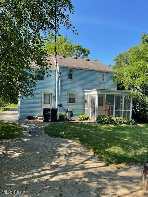 260 Morgan, Oberlin, OH 44074 - back of house with a sunroom and a lawn