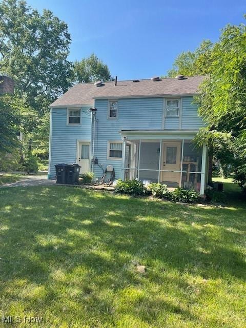 260 Morgan, Oberlin, OH 44074 - rear view of house with a yard and a sunroom