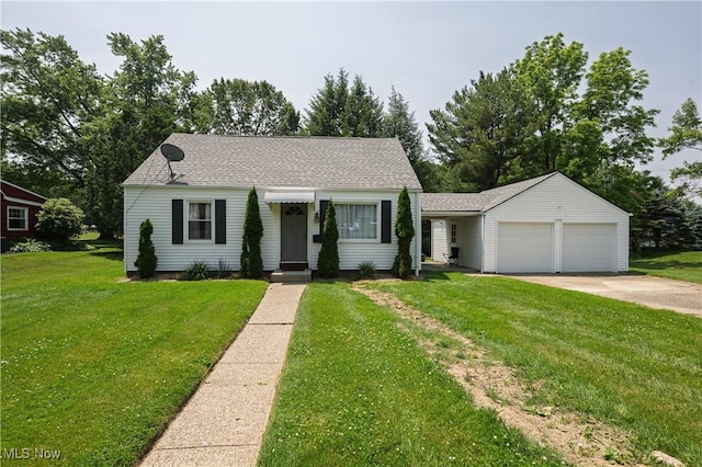 1209 Oak Ave SE, Massillon, OH 44646 - view of front of house with an attached garage, a front yard, driveway, and roof with shingles