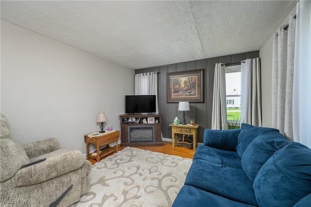 1209 Oak Ave SE, Massillon, OH 44646 - living room with wood finished floors and a textured ceiling