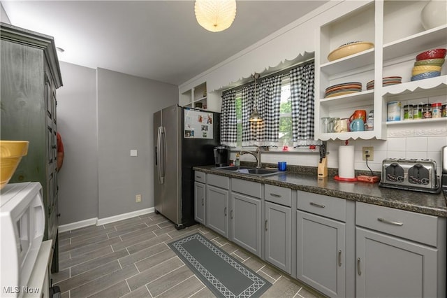 1209 Oak Ave SE, Massillon, OH 44646 - kitchen with stainless steel refrigerator with ice dispenser, gray cabinetry, open shelves, and dark countertops