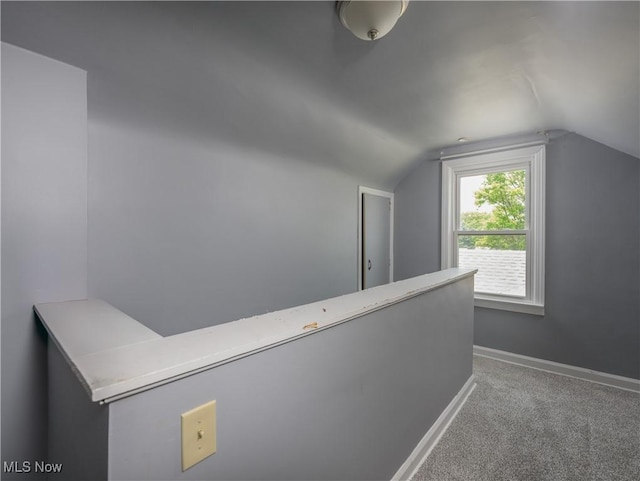 1209 Oak Ave SE, Massillon, OH 44646 - corridor featuring vaulted ceiling and carpet