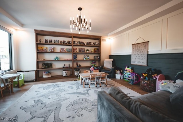 7363 Kempton Ct, Canfield, OH 44406 - living room featuring a chandelier and light wood finished floors