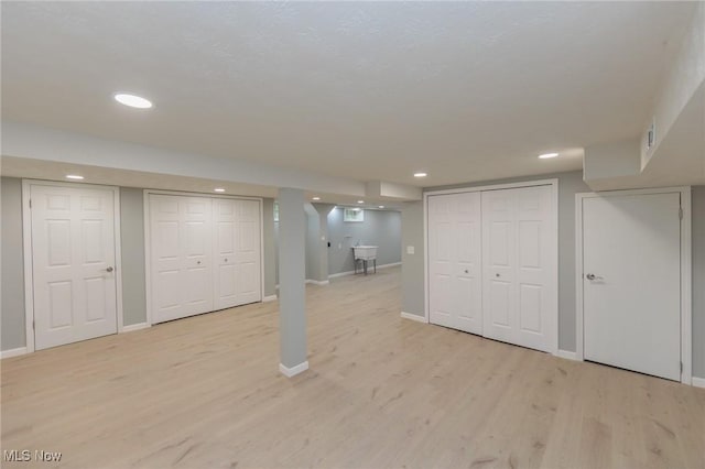 6114 Crossview Rd, Seven Hills, OH 44131 - finished basement featuring light wood finished floors and recessed lighting