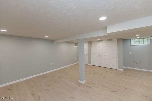 6114 Crossview Rd, Seven Hills, OH 44131 - below grade area featuring light wood finished floors, recessed lighting, and a textured ceiling