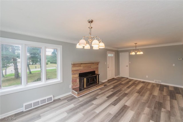 6114 Crossview Rd, Seven Hills, OH 44131 - unfurnished living room with a chandelier and wood finished floors