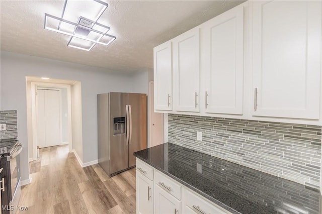 6114 Crossview Rd, Seven Hills, OH 44131 - kitchen featuring stainless steel refrigerator with ice dispenser, white cabinetry, light wood finished floors, a textured ceiling, and backsplash
