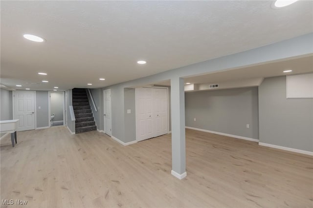 6114 Crossview Rd, Seven Hills, OH 44131 - finished below grade area featuring light wood-style floors, stairway, and recessed lighting