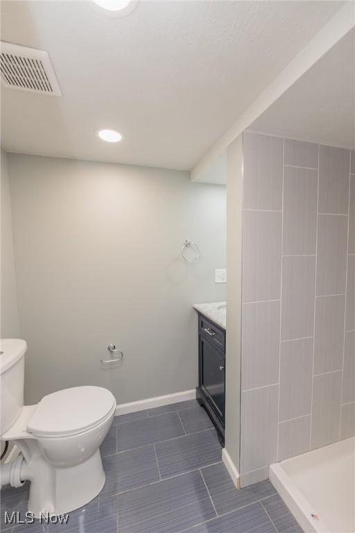 6114 Crossview Rd, Seven Hills, OH 44131 - full bathroom with vanity, a tile shower, and tile patterned flooring