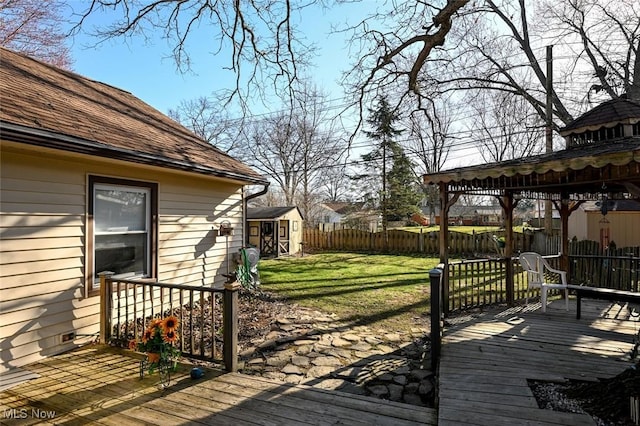 145 Edgewood Dr, Berea, OH 44017 - wooden deck with a fenced backyard, a shed, and a gazebo