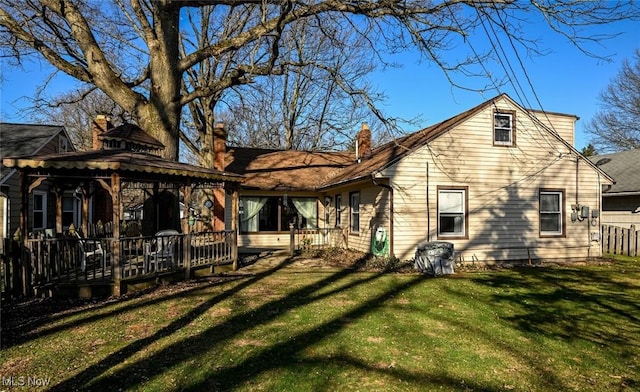 145 Edgewood Dr, Berea, OH 44017 - back of property with a gazebo, a lawn, a chimney, and a wooden deck