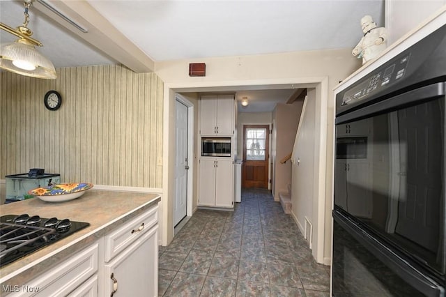 145 Edgewood Dr, Berea, OH 44017 - kitchen featuring black appliances, white cabinetry, and light countertops