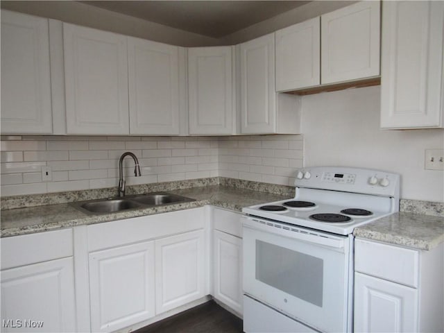 4078 E 154th St, Cleveland, OH 44128 - kitchen with white range with electric cooktop, white cabinetry, tasteful backsplash, and light countertops