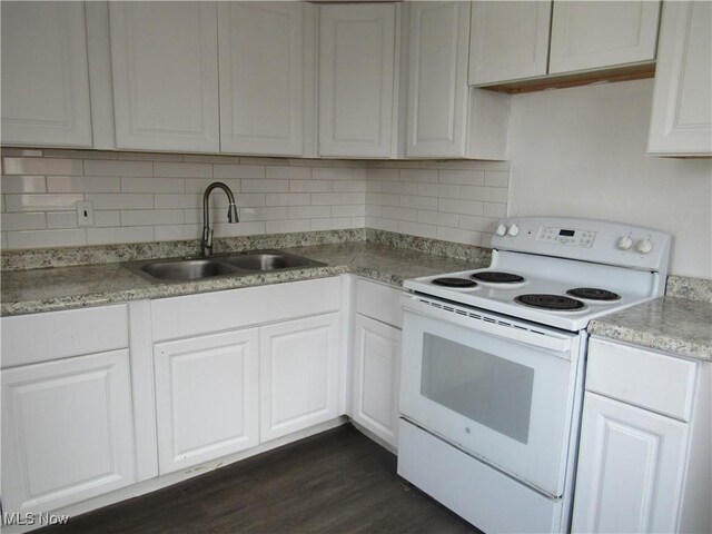 4078 E 154th St, Cleveland, OH 44128 - kitchen with white electric range oven, backsplash, white cabinetry, light countertops, and dark wood-style flooring