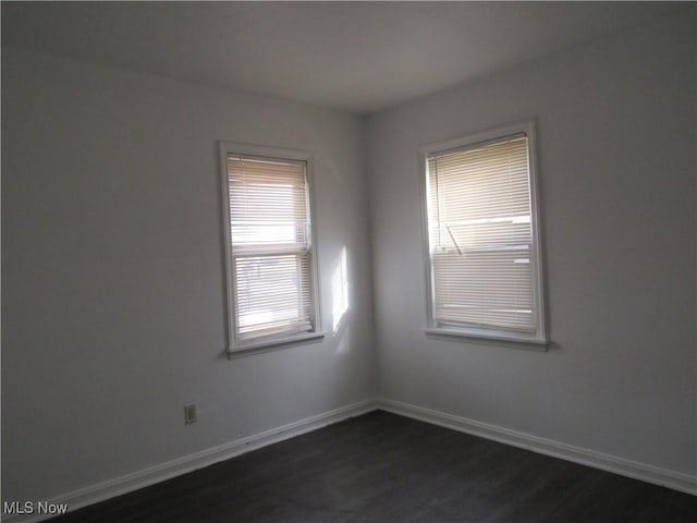 4078 E 154th St, Cleveland, OH 44128 - spare room with dark wood-style floors and baseboards