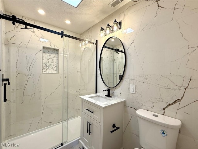 2337 Charney Rd, University Heights, OH 44118 - bathroom featuring vanity, a marble finish shower, a textured ceiling, tile walls, and recessed lighting
