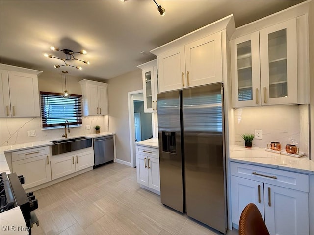 2337 Charney Rd, University Heights, OH 44118 - kitchen with stainless steel appliances, decorative backsplash, white cabinets, and glass insert cabinets