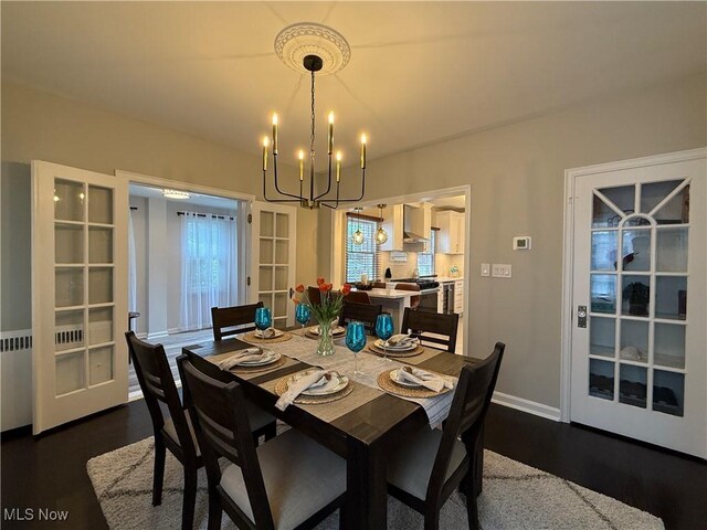2337 Charney Rd, University Heights, OH 44118 - dining room featuring a chandelier, healthy amount of natural light, and dark wood-style floors