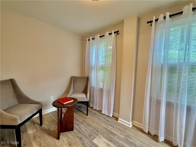 2337 Charney Rd, University Heights, OH 44118 - living area with baseboards and light wood finished floors
