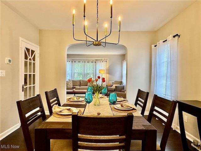 2337 Charney Rd, University Heights, OH 44118 - dining space with arched walkways and a chandelier