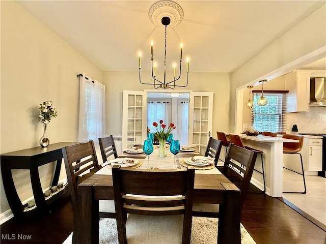 2337 Charney Rd, University Heights, OH 44118 - dining room featuring a chandelier and light wood finished floors