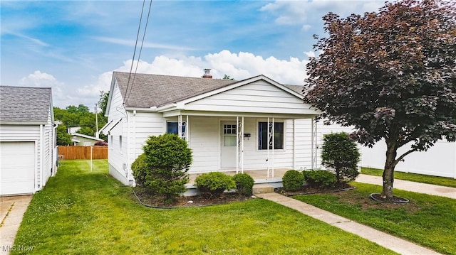 3606 Liberty St, Parkersburg, WV 26104 - bungalow-style house featuring a porch, a shingled roof, and a garage