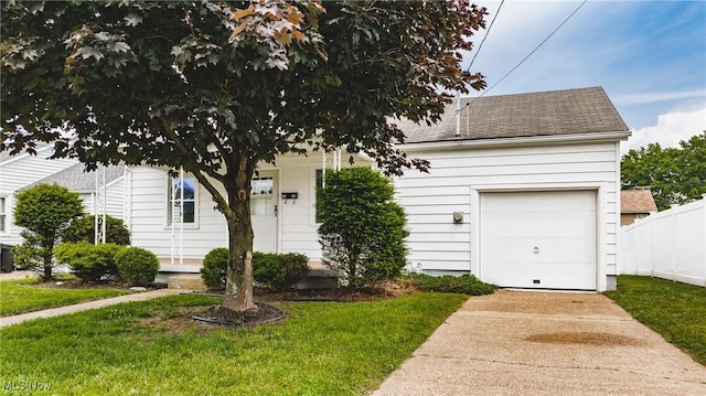 3606 Liberty St, Parkersburg, WV 26104 - view of property hidden behind natural elements featuring driveway, a shingled roof, and a garage