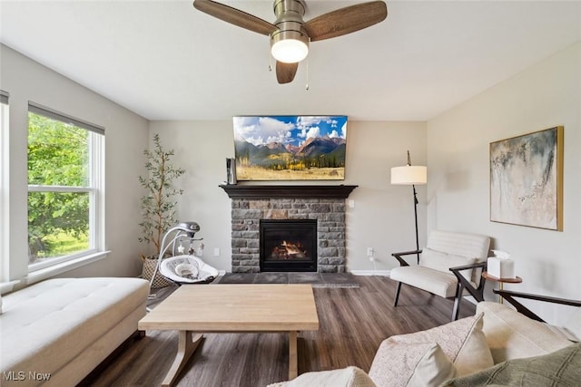 3523 Magnolia Dr, Lorain, OH 44053 - living area featuring wood finished floors, healthy amount of natural light, a fireplace, and ceiling fan