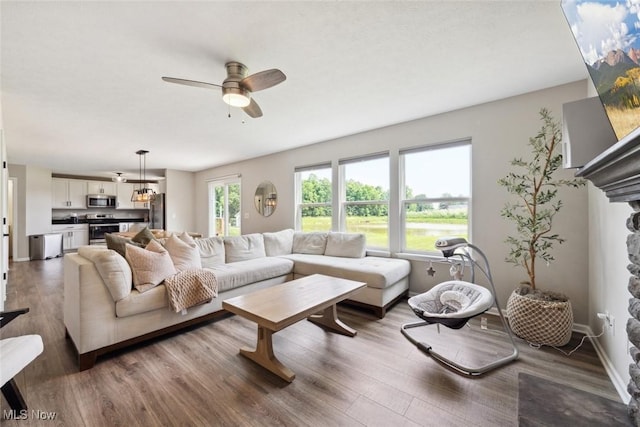 3523 Magnolia Dr, Lorain, OH 44053 - living room featuring ceiling fan and wood finished floors