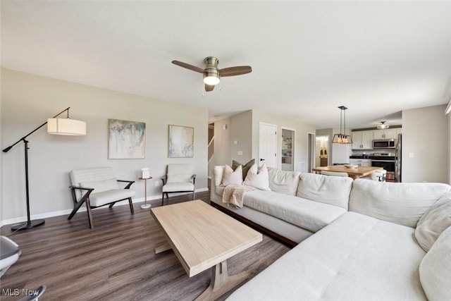 3523 Magnolia Dr, Lorain, OH 44053 - living room with a ceiling fan and dark wood-type flooring