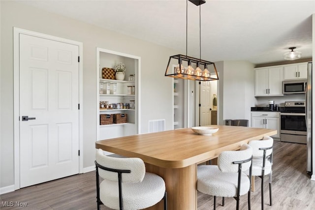 3523 Magnolia Dr, Lorain, OH 44053 - dining area featuring wood finished floors