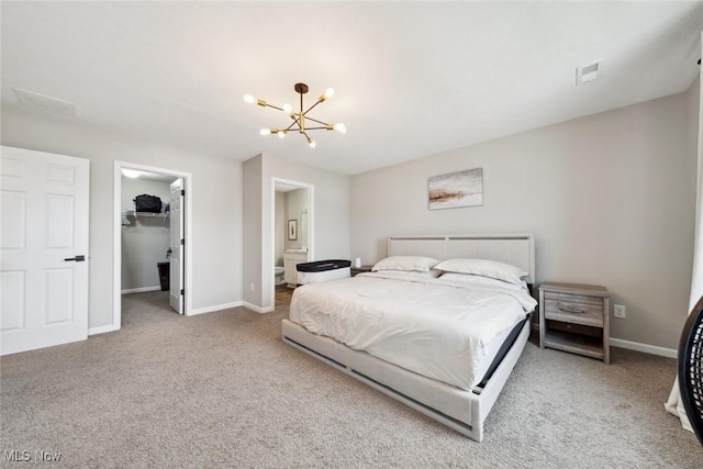 3523 Magnolia Dr, Lorain, OH 44053 - bedroom with carpet flooring, a walk in closet, a chandelier, a closet, and connected bathroom