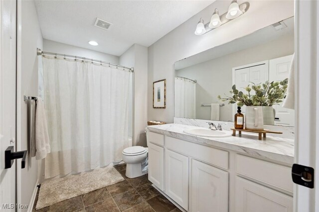 3523 Magnolia Dr, Lorain, OH 44053 - full bathroom featuring vanity and stone finish floors