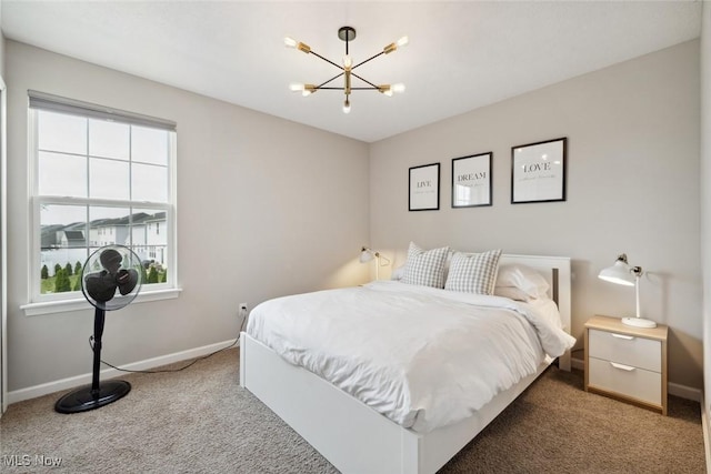3523 Magnolia Dr, Lorain, OH 44053 - bedroom with multiple windows, carpet floors, and a chandelier