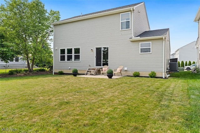 3523 Magnolia Dr, Lorain, OH 44053 - back of house featuring a patio and a lawn