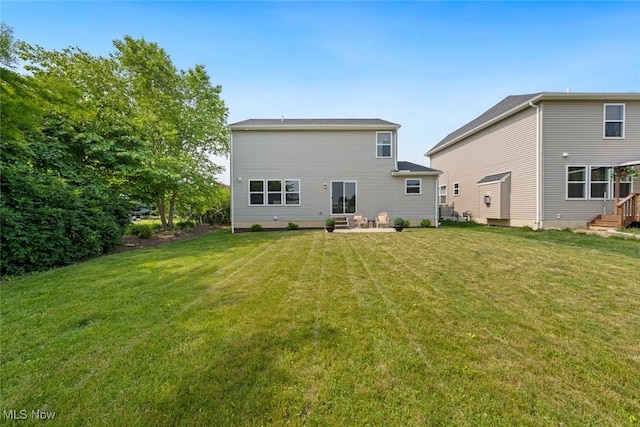 3523 Magnolia Dr, Lorain, OH 44053 - rear view of property with a yard