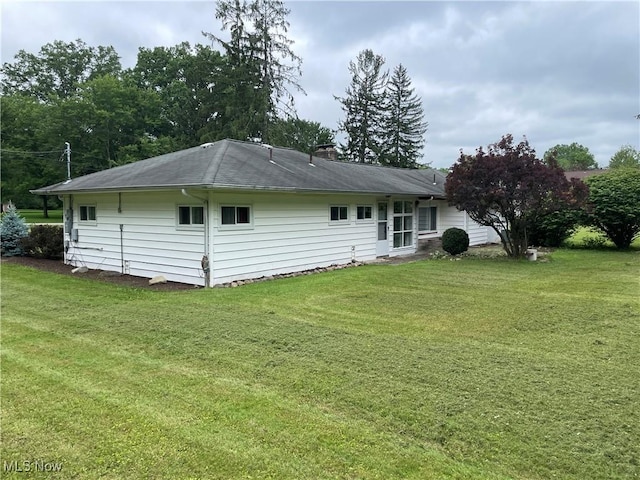 1781 Pleasant Valley Rd, Girard, OH 44420 - rear view of property with a yard and a chimney