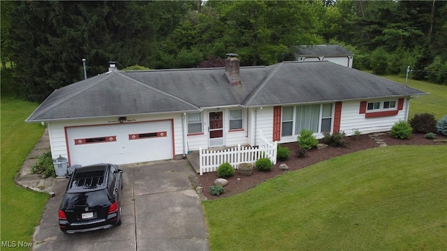 1781 Pleasant Valley Rd, Girard, OH 44420 - ranch-style home with a chimney, driveway, a garage, and a front lawn