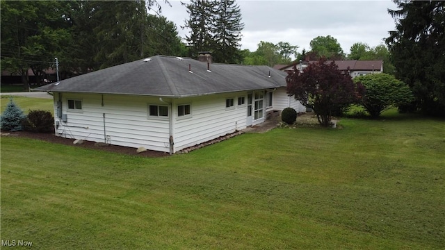 1781 Pleasant Valley Rd, Girard, OH 44420 - rear view of property with a lawn, a chimney, and a shingled roof