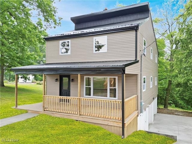 209 Beechwood Blvd, Wintersville, OH 43953 - american foursquare style home featuring a porch, a front yard, a metal roof, and driveway