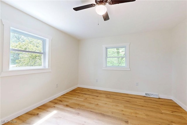 209 Beechwood Blvd, Wintersville, OH 43953 - empty room with healthy amount of natural light, light wood finished floors, and ceiling fan