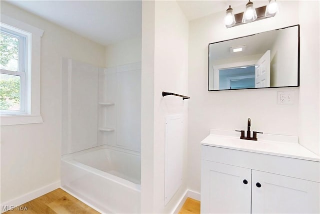 209 Beechwood Blvd, Wintersville, OH 43953 - bathroom with vanity, wood finished floors, and tub / shower combination